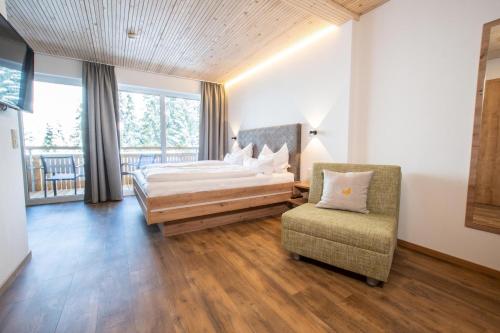 Postelja oz. postelje v sobi nastanitve Alpengasthof Hörnlepass
