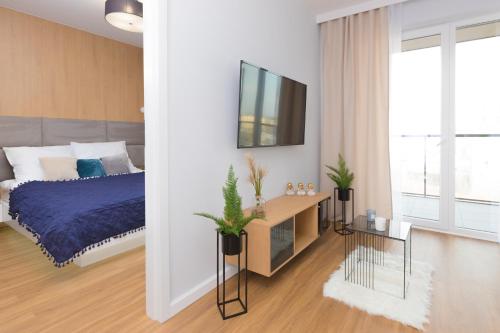 Кровать или кровати в номере Maloves Apartment NETFLIX