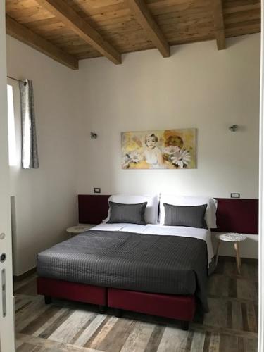 a bedroom with a large bed in a room at Agriturismo Ali E Radici in Cisterna di Latina