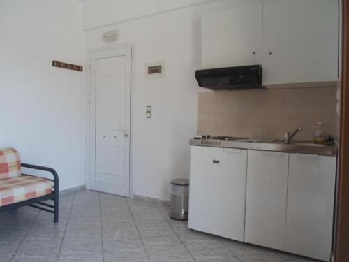 a kitchen with a sink and a counter top at Costareli in Fourni Ikarias