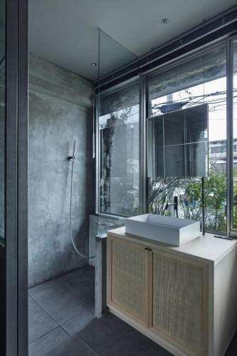 a bathroom with a sink and a large window at hotel sou #sou in Goto