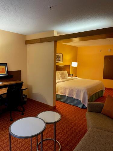 a hotel room with a bed and a desk at Baymont by Wyndham Chambersburg in Chambersburg