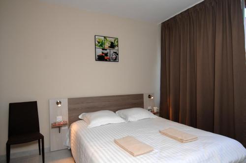 Ліжко або ліжка в номері Résidence Odalys Du Golfe