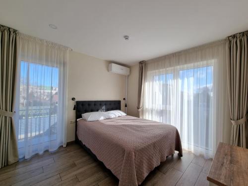 Llit o llits en una habitació de Vila Amber drop