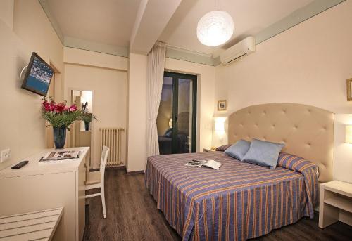 Postel nebo postele na pokoji v ubytování Hotel Panoramica