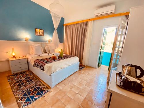 Postel nebo postele na pokoji v ubytování El Gezira Hotel