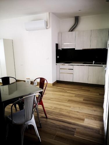 a kitchen and dining room with a table and chairs at La Casetta in La Spezia