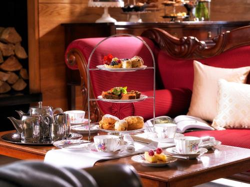 a table with plates of food on a red chair at West Cork Hotel in Skibbereen