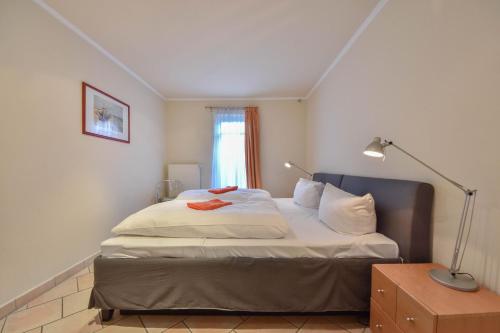 Giường trong phòng chung tại Residenz Bleichröder 10