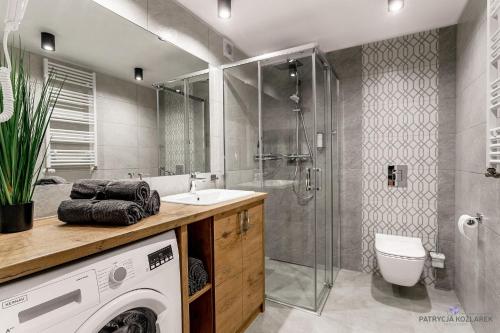 Ett badrum på Apartamenty IGMA
