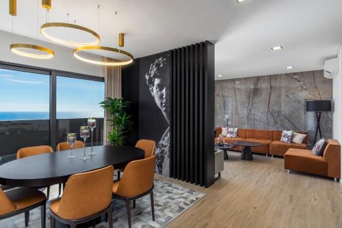 a living room with a table and chairs at Villa Belmonte by LovelyStay in Ponta do Sol