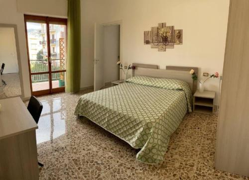 Ένα ή περισσότερα κρεβάτια σε δωμάτιο στο A Casa e' Mammà