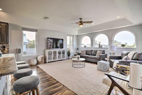 a living room with a couch and a table at Heated PoolandSpa and Dock Apollo Beach Home on Canal in Apollo Beach