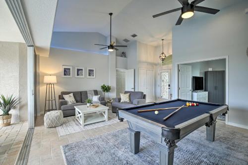 a living room with a pool table in it at Heated PoolandSpa and Dock Apollo Beach Home on Canal in Apollo Beach