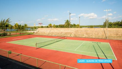 
a tennis court with a tennis racket on it at Vila Galé Eco Resort do Cabo - All Inclusive in Cabo de Santo Agostinho
