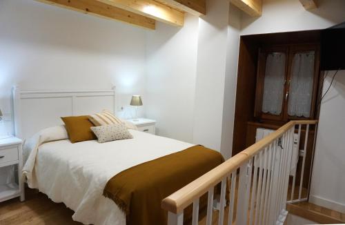 Ένα ή περισσότερα κρεβάτια σε δωμάτιο στο Apartamentos Turísticos El Peñón