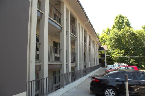 a black car parked in front of a building at The University Inn at Emory in Atlanta