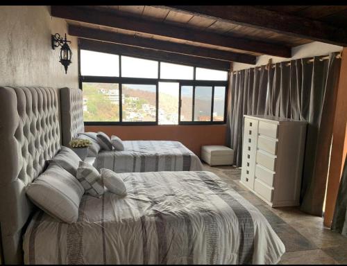 Кровать или кровати в номере DEPARTAMENTOS VERACRUZ