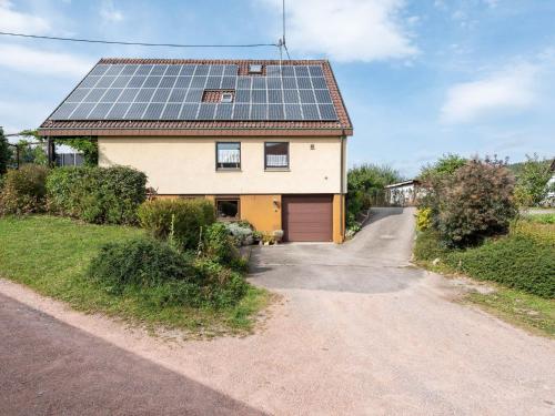 a house with solar panels on the roof at Apartment with balcony in the Black Forest in Kappel