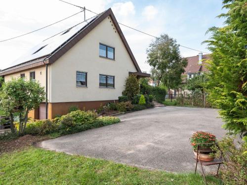 an empty driveway in front of a house at Apartment with balcony in the Black Forest in Kappel