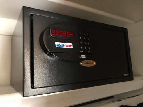 a microwave oven with a clock on top of it at Suites at 249 in Culpeper