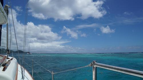 a view of the ocean from the bow of a boat at Luxury secluded villa with private pool sleeps six in Jolly Harbour