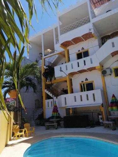 a view of the hotel from the pool at MonteMar Hotel y Bungalows in Rincon de Guayabitos