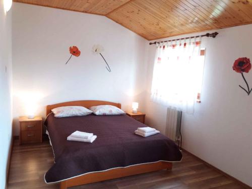 a bedroom with a bed with two towels on it at Apartment in Rovinj/Istrien 11560 in Štanga