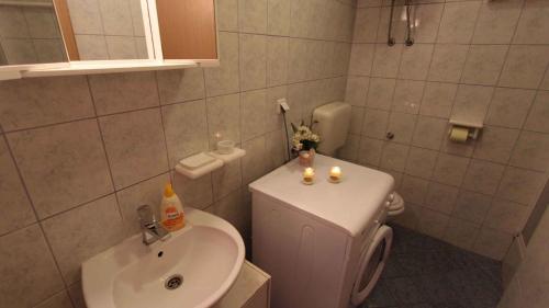 a small bathroom with a toilet and a sink at Apartment in Malinska/Insel Krk 14682 in Porat