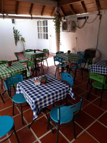 an empty room with tables and chairs in a restaurant at Hotel Cartagena Airport in Cartagena de Indias