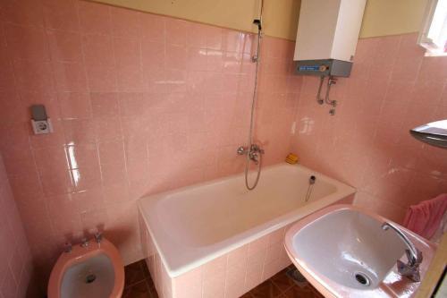 a bathroom with a toilet and a tub and a sink at Apartment in Silo/Insel Krk 14539 in Šilo