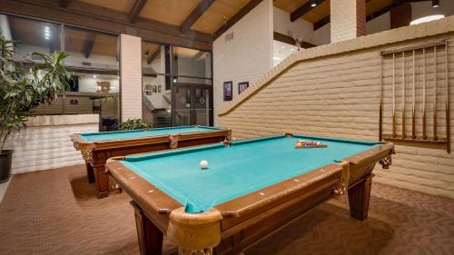 
a green and white swimming pool in a room at Best Western Plus Arroyo Roble Hotel & Creekside Villas in Sedona
