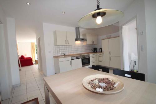 a kitchen with a table with a plate on it at Apartment Rambin 3 in Rambin