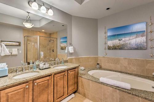 a bathroom with two sinks and a tub and a large mirror at 30A Retreat with Patio and Resort Amenities! in Santa Rosa Beach