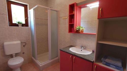 a bathroom with a toilet and a shower and a sink at Apartment Malinska, Krk 19 in Malinska