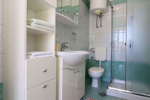 a bathroom with a toilet and a sink and a shower at Apartment in Silo/Insel Krk 13441 in Šilo