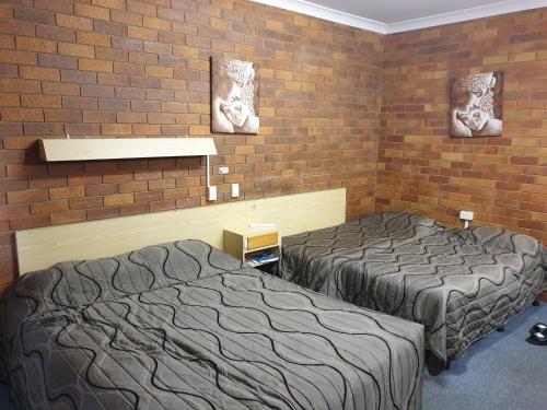 Ein Bett oder Betten in einem Zimmer der Unterkunft Glen Innes Lodge Motel