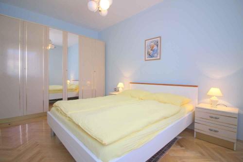 a bedroom with a large bed and two night stands at Apartment in Porec/Istrien 10303 in Poreč