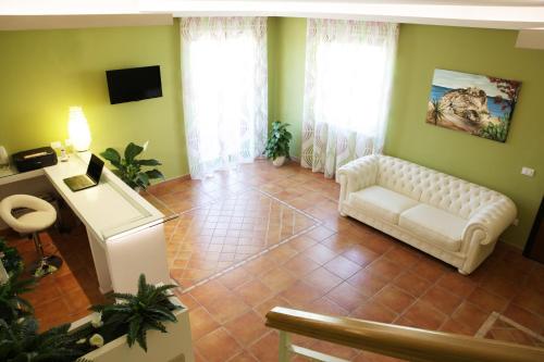 TV a/nebo společenská místnost v ubytování B&B Il Quadrifoglio Tropea