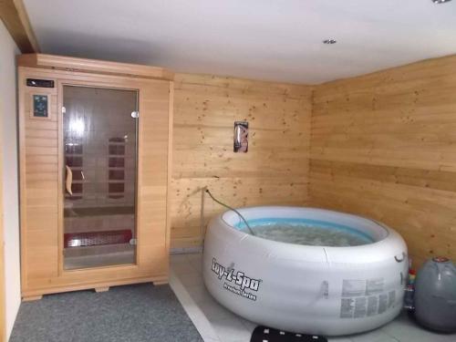 a wellness center with a bath tub in a room at Holiday home in Svahova - Erzgebirge 1640 in Svahová