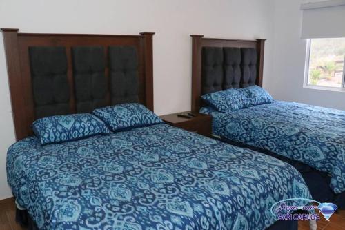Postel nebo postele na pokoji v ubytování Departamento Turquesa 4 Joyas de San Carlos