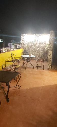 a group of tables and chairs in a room at Casa Fernery in Valladolid