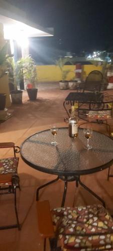 a table with two glasses of wine on it at Casa Fernery in Valladolid