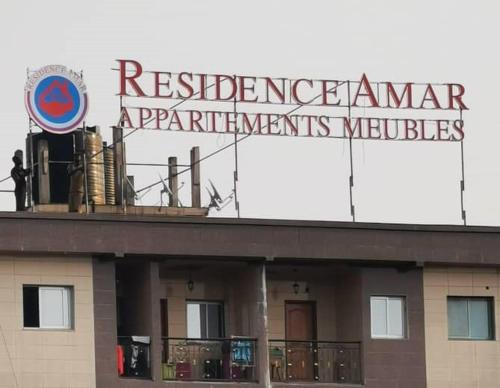 a sign on the top of a building at RESIDENCE AMAR in Douala