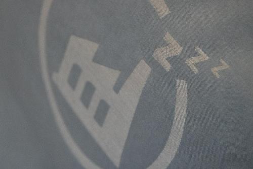 a reflection of a stop sign on a curtain at Das Schlafwerk Stuttgart-Nord VOLLDIGITALES HOTEL-SELF-CHECK IN - keine Rezeption-LowBudget-cashless in Korntal-Münchingen