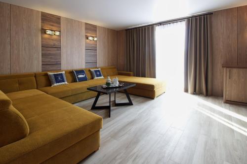 a living room with a couch and a table at Aparton in Ustka