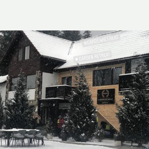 a building with a christmas tree in front of it at Garden Retreat in Bran