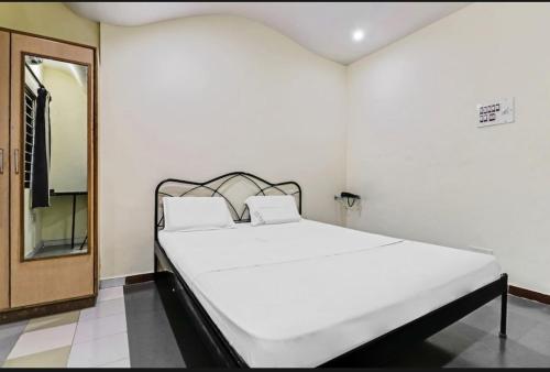 Cama o camas de una habitación en Shanthi Comforts