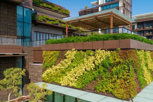 a vertical garden on the side of a building at 1 Hotel Haitang Bay, Sanya in Sanya
