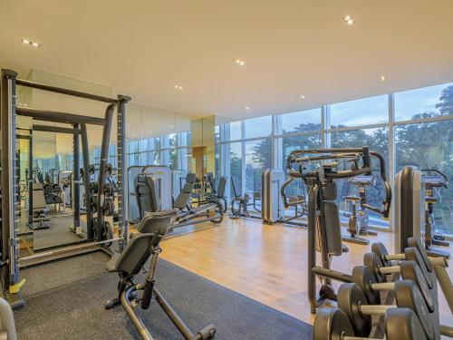 a gym with cardio equipment in a building at LOTTE Hotel Serviced Apartment in Yangon